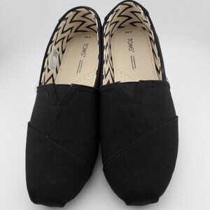 Tom's black loafer